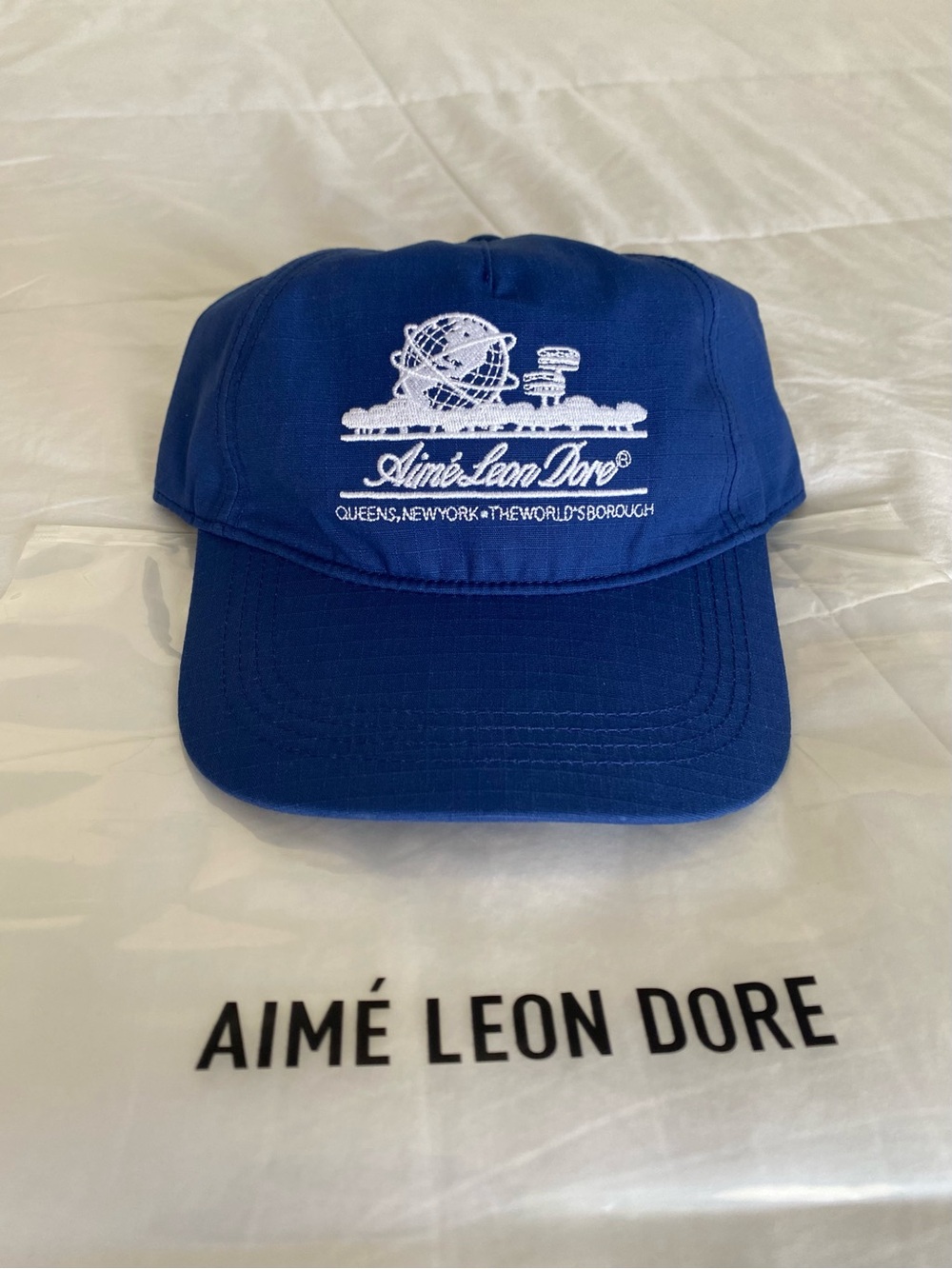 Aime Leon Dore Unisphere Hat In Royal Blue.